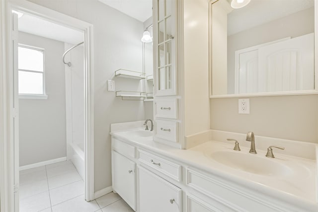 28902 Twisted Oak Dr, Shenandoah, TX 77381 - full bathroom with tile patterned flooring, double vanity, baseboards, and shower / bath combination