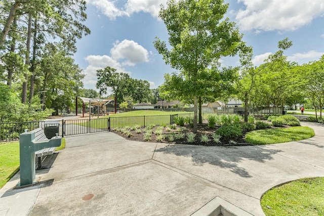 28902 Twisted Oak Dr, Shenandoah, TX 77381 - view of home's community with fence and a gate