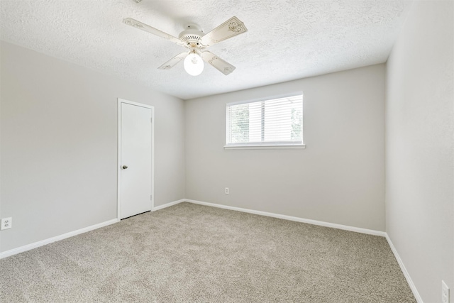 28902 Twisted Oak Dr, Shenandoah, TX 77381 - spare room featuring carpet, ceiling fan, a textured ceiling, and baseboards