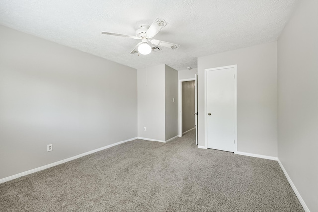 28902 Twisted Oak Dr, Shenandoah, TX 77381 - empty room with ceiling fan, carpet floors, a textured ceiling, and baseboards