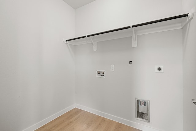 33019 School Hill Rd, Fulshear, TX 77441 - washroom with electric dryer hookup, washer hookup, baseboards, and light wood-style flooring