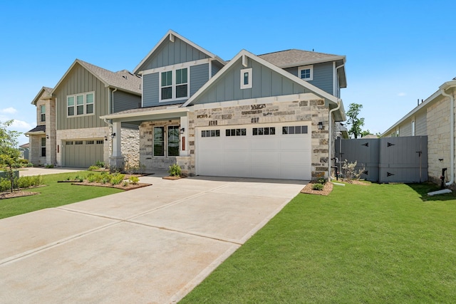 33019 School Hill Rd, Fulshear, TX 77441 - craftsman house with board and batten siding, driveway, a front yard, and stone siding