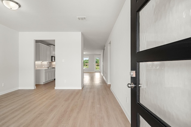 33019 School Hill Rd, Fulshear, TX 77441 - entrance foyer with light wood-style flooring and baseboards