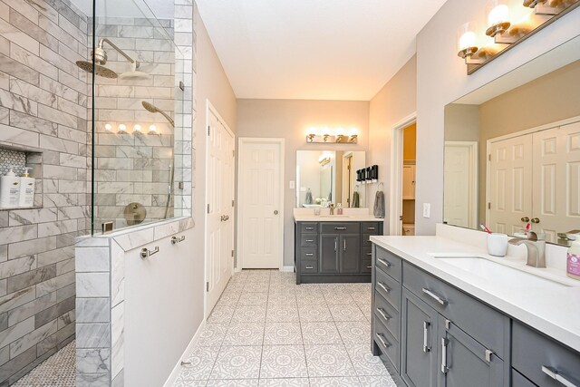13907 Pawnee Trails Dr, Cypress, TX 77429 - bathroom featuring a walk in shower, two vanities, and baseboards