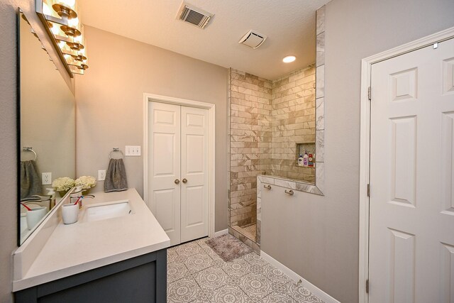 13907 Pawnee Trails Dr, Cypress, TX 77429 - bathroom with a walk in shower, vanity, baseboards, tile patterned floors, and recessed lighting