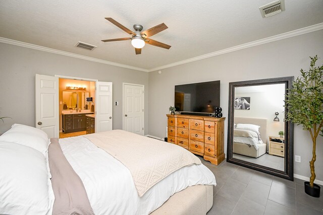 13907 Pawnee Trails Dr, Cypress, TX 77429 - bedroom featuring ornamental molding, tile patterned floors, ensuite bathroom, baseboards, and ceiling fan