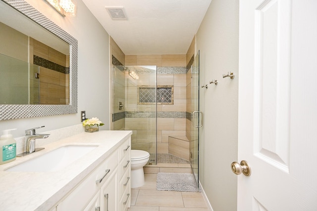 13907 Pawnee Trails Dr, Cypress, TX 77429 - full bathroom with tile patterned flooring, a shower stall, vanity, and toilet