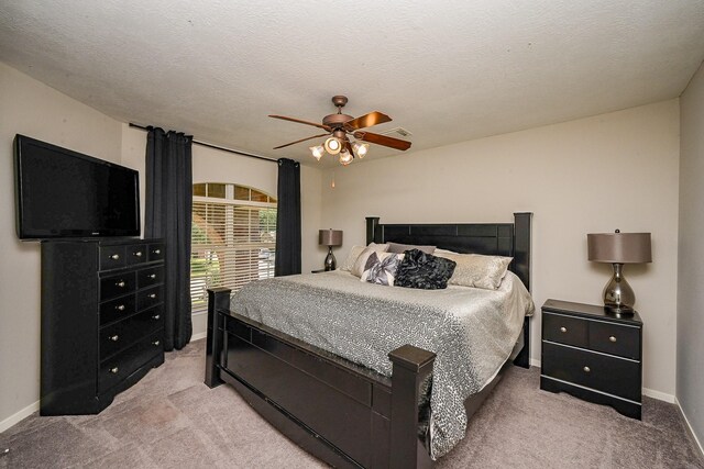 13907 Pawnee Trails Dr, Cypress, TX 77429 - bedroom with light colored carpet, baseboards, and ceiling fan