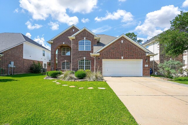 13907 Pawnee Trails Dr, Cypress, TX 77429 - traditional-style house with brick siding, an attached garage, a front lawn, and concrete driveway