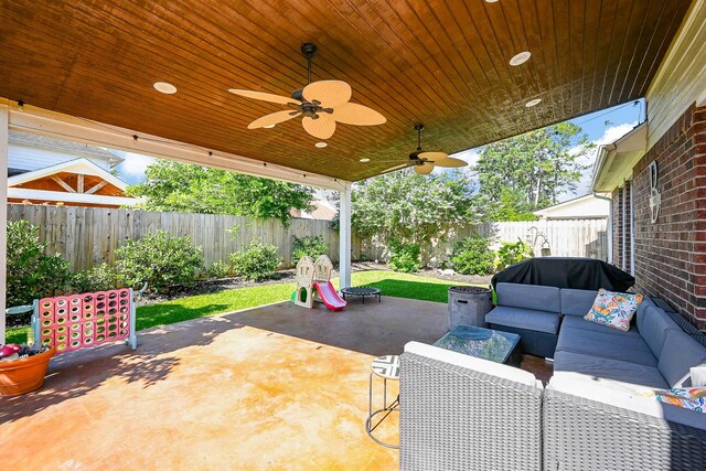 13907 Pawnee Trails Dr, Cypress, TX 77429 - fenced backyard with an outdoor hangout area, a patio, and a ceiling fan