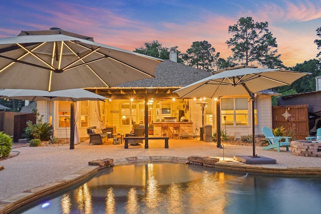 6123 Cypress Way Dr, Magnolia, TX 77354 - rear view of house with an outdoor fire pit, a patio, fence, and a chimney