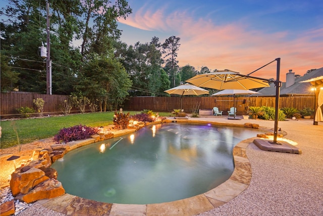6123 Cypress Way Dr, Magnolia, TX 77354 - pool at dusk featuring a patio and an outdoor fire pit