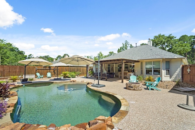 6123 Cypress Way Dr, Magnolia, TX 77354 - view of swimming pool featuring an outdoor fire pit, a patio, and a fenced backyard