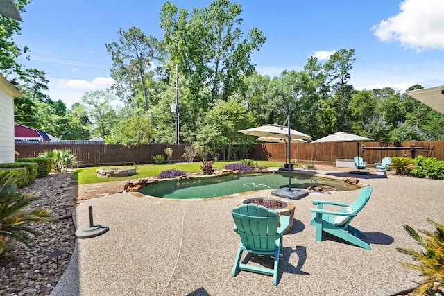 6123 Cypress Way Dr, Magnolia, TX 77354 - view of patio with a fire pit and a fenced backyard