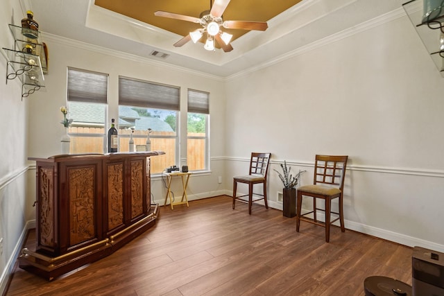 6123 Cypress Way Dr, Magnolia, TX 77354 - sitting room with dark wood-style flooring, a tray ceiling, ceiling fan, crown molding, and baseboards