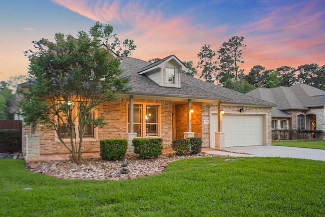 6123 Cypress Way Dr, Magnolia, TX 77354 - view of front of house with brick siding, a garage, a front lawn, and driveway