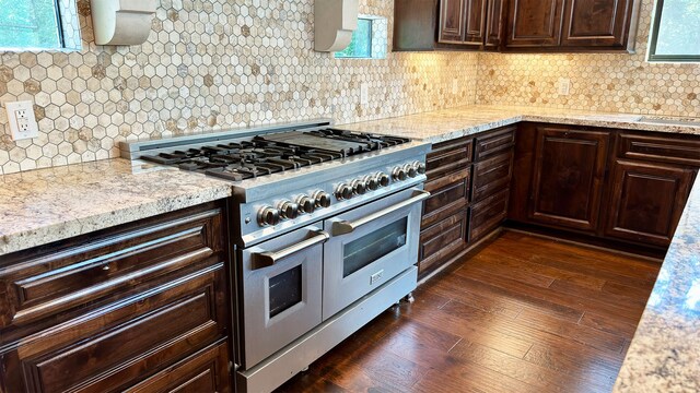 4818 Lake Village Dr, Fulshear, TX 77441 - kitchen with range with two ovens, dark brown cabinetry, backsplash, and light stone counters