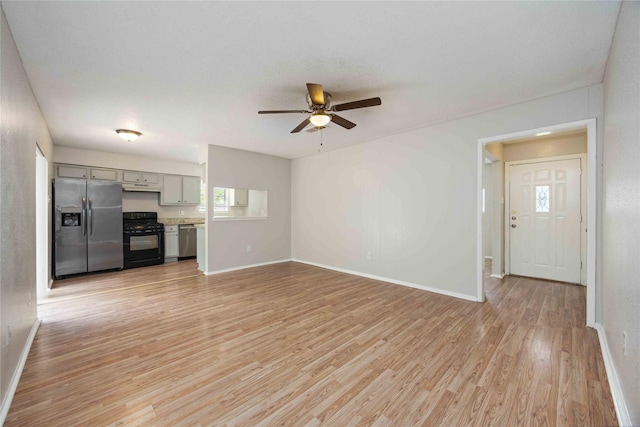 11750 Murr Way, Houston, TX 77048 - unfurnished living room featuring light wood-style flooring, a ceiling fan, and baseboards
