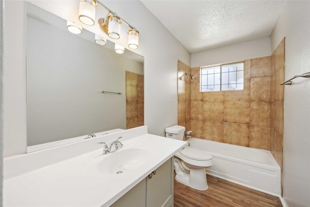 11750 Murr Way, Houston, TX 77048 - bathroom with wood finished floors, a textured ceiling, toilet, shower / bathtub combination, and vanity