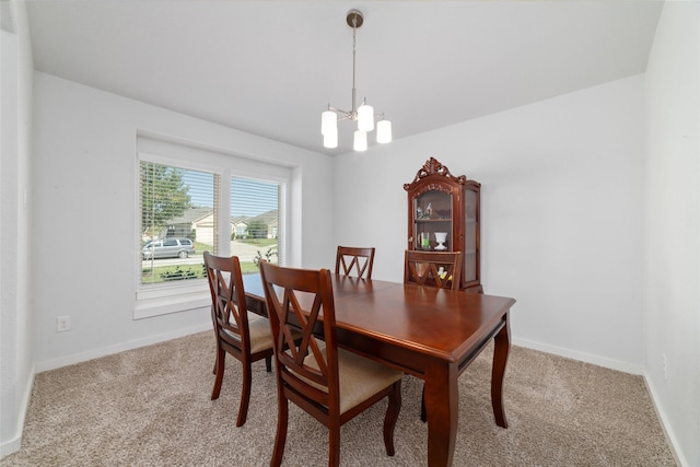 6815 Bardsdale Ct, Rosharon, TX 77583 - carpeted dining space featuring a chandelier and baseboards