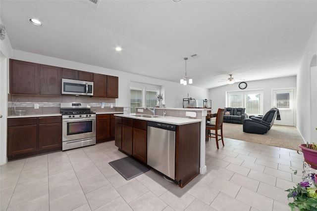 6815 Bardsdale Ct, Rosharon, TX 77583 - kitchen with appliances with stainless steel finishes, light countertops, plenty of natural light, a sink, and recessed lighting