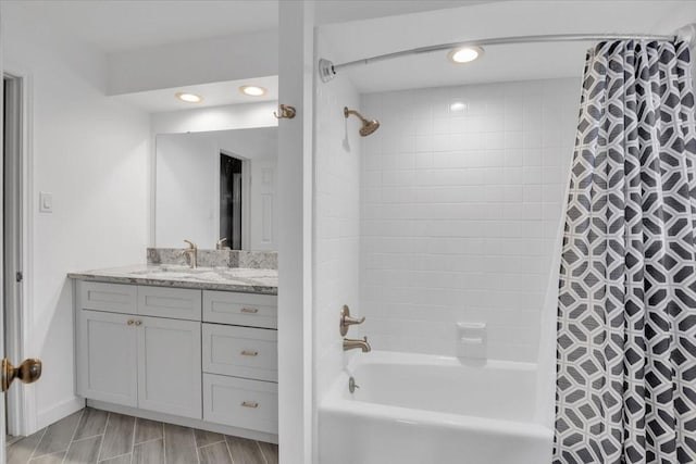 12151 Maple Rock Dr, Houston, TX 77077 - full bathroom with vanity, shower / bath combination with curtain, and recessed lighting