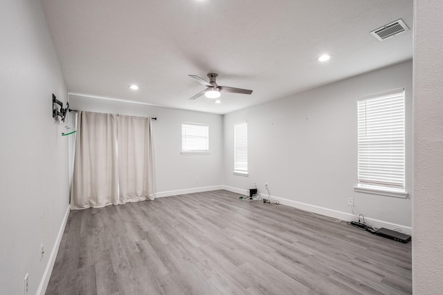 9026 Mcgallion Rd, Houston, TX 77022 - unfurnished room featuring a ceiling fan, baseboards, wood finished floors, and recessed lighting