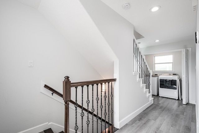9026 Mcgallion Rd, Houston, TX 77022 - staircase featuring independent washer and dryer, wood finished floors, recessed lighting, and baseboards