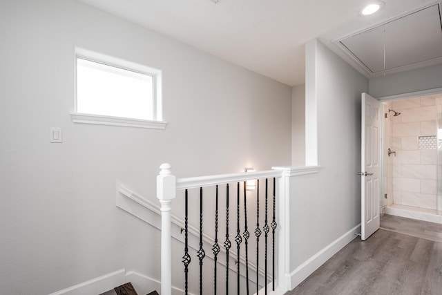 9026 Mcgallion Rd, Houston, TX 77022 - staircase with attic access, wood finished floors, and baseboards