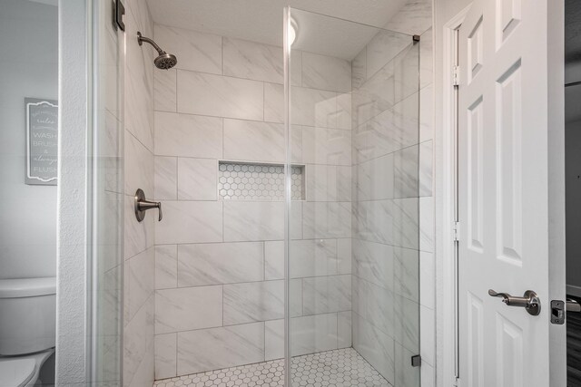 9026 Mcgallion Rd, Houston, TX 77022 - bathroom featuring toilet and a shower stall
