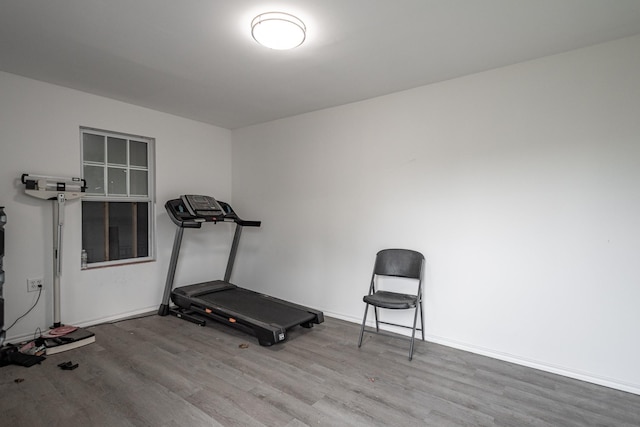 9026 Mcgallion Rd, Houston, TX 77022 - workout room with wood finished floors and baseboards