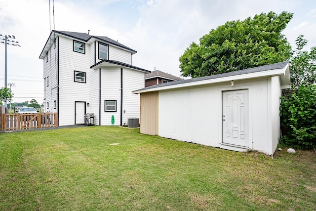 9026 Mcgallion Rd, Houston, TX 77022 - back of property with an outdoor structure and central AC