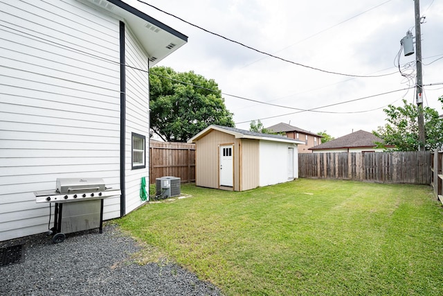 9026 Mcgallion Rd, Houston, TX 77022 - view of yard featuring central air condition unit, an outdoor structure, and a shed
