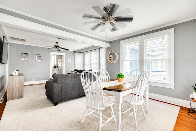 711 17th St, Galveston, TX 77550 - dining space with ceiling fan, crown molding, baseboards, and light wood-type flooring