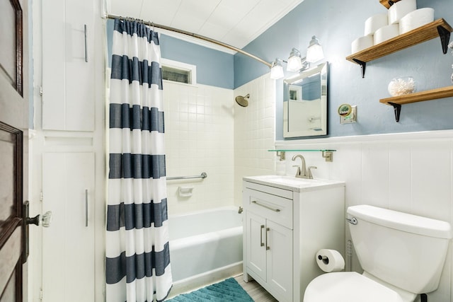 711 17th St, Galveston, TX 77550 - bathroom with toilet, shower / tub combo, wainscoting, and vanity