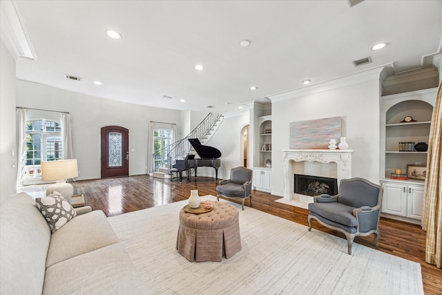 1 Exbury Way, Houston, TX 77056 - living room with stairs, healthy amount of natural light, wood finished floors, ornamental molding, and a fireplace