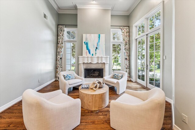1 Exbury Way, Houston, TX 77056 - living room featuring baseboards, a fireplace, wood finished floors, a high ceiling, and crown molding
