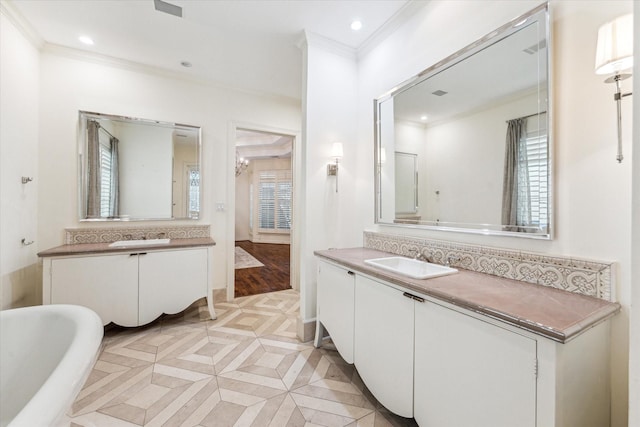 1 Exbury Way, Houston, TX 77056 - bathroom with crown molding, plenty of natural light, a freestanding tub, recessed lighting, and two vanities