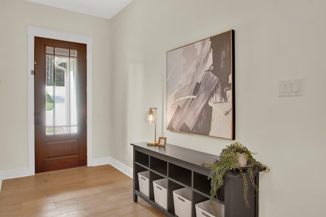 6114 E Bluff Ct, Magnolia, TX 77354 - entryway with healthy amount of natural light, light wood-style floors, and baseboards