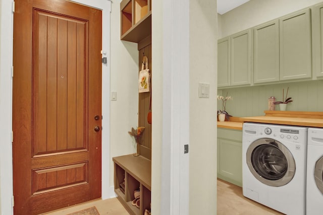 6114 E Bluff Ct, Magnolia, TX 77354 - clothes washing area with cabinet space and washer and clothes dryer
