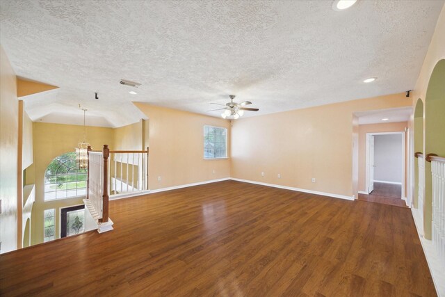 19119 Timber Trace Dr, Humble, TX 77346 - unfurnished room with a textured ceiling, wood finished floors, ceiling fan, a chandelier, and baseboards