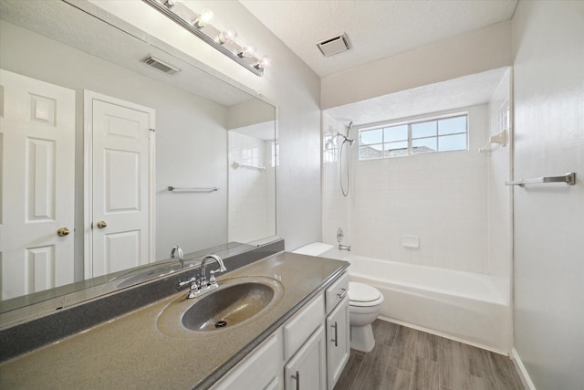 19119 Timber Trace Dr, Humble, TX 77346 - full bathroom featuring toilet, wood finished floors, vanity, and shower / bath combination