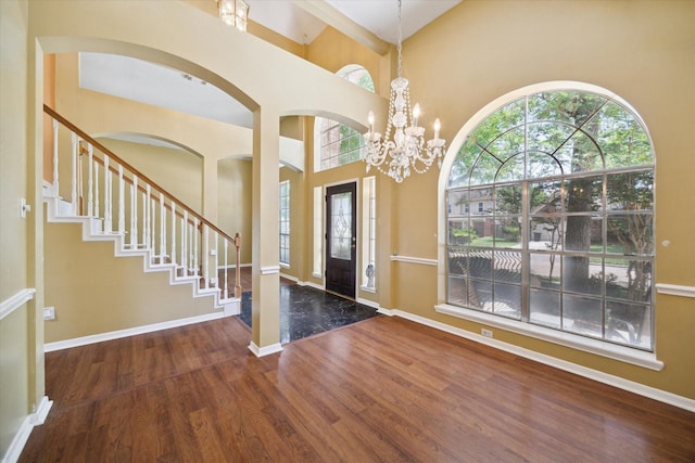 19119 Timber Trace Dr, Humble, TX 77346 - foyer with wood finished floors, healthy amount of natural light, a high ceiling, baseboards, and a chandelier