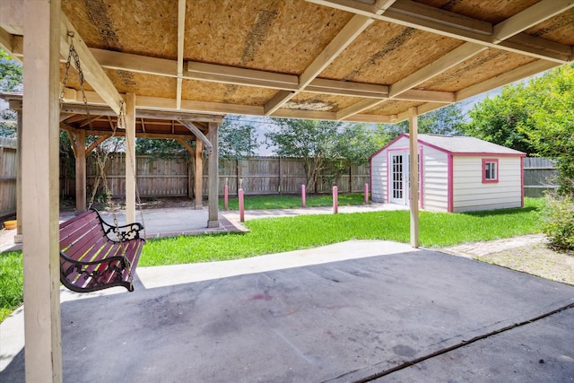 19119 Timber Trace Dr, Humble, TX 77346 - view of patio with a storage shed and an outbuilding
