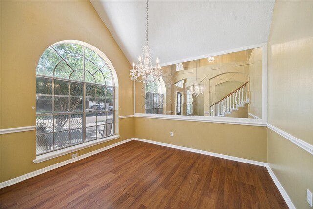19119 Timber Trace Dr, Humble, TX 77346 - unfurnished dining area with a chandelier, wood finished floors, baseboards, and high vaulted ceiling