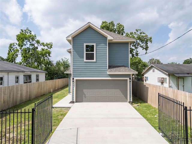 7983 Ethel St, Houston, TX 77028 - view of front of home featuring a shingled roof, an attached garage, and concrete driveway