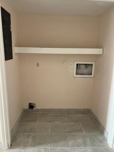 7847 Creekbend Dr, Houston, TX 77071 - washroom featuring electric dryer hookup, hookup for a washing machine, electric panel, and baseboards