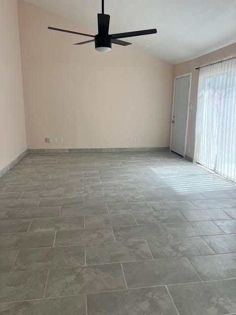 7847 Creekbend Dr, Houston, TX 77071 - unfurnished room featuring ceiling fan, lofted ceiling, and baseboards