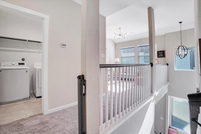 477 Long Leaf Pine Dr, Montgomery, TX 77316 - hallway featuring a chandelier, separate washer and dryer, an upstairs landing, and carpet