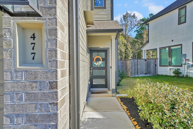 477 Long Leaf Pine Dr, Montgomery, TX 77316 - doorway to property featuring fence and stone siding